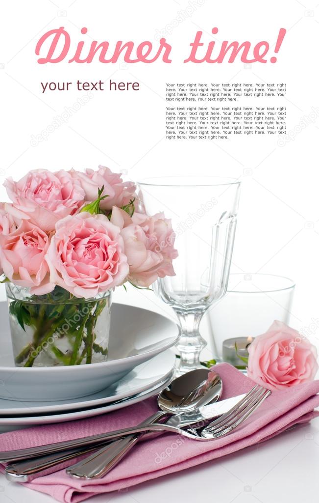 Festive table setting with pink roses