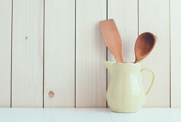 Kitchen utensils in ceramic jug — Stock Photo, Image