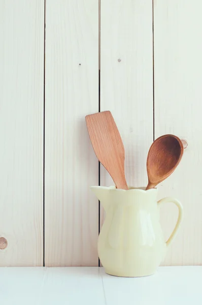 Kitchen utensils in ceramic jug — Stock Photo, Image