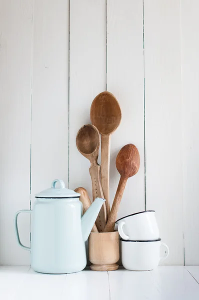 coffee pot, enamel mugs and rustic spoons