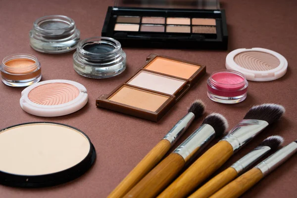 Group of cosmetic and makeup products on studio background — Stock Photo, Image