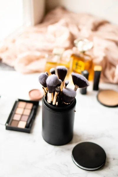 Set of luxurious black makeup brushes in leather case — Stock Photo, Image