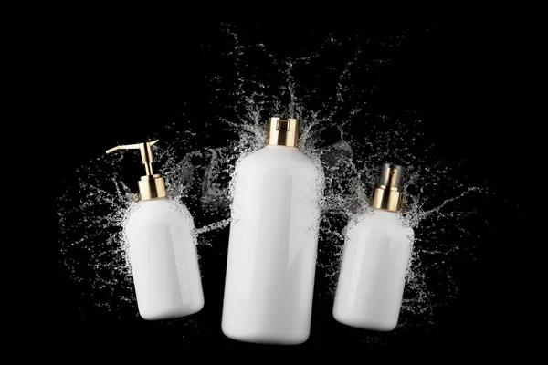 Three Different Cosmetic Bottles Water Splash Isolated Black Background Render — Photo