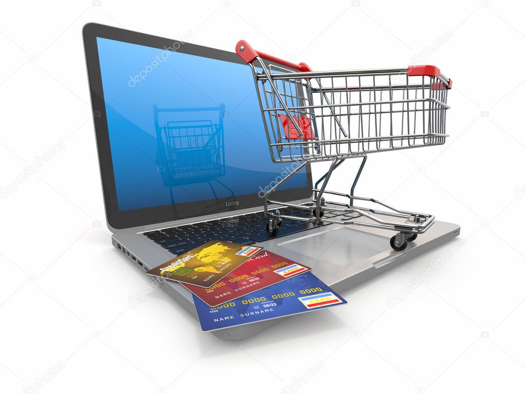 E-commerce. Shopping cart and credit cards on laptop