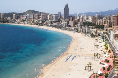 Hotels and beach of Benidorm. Sky and sea. clipart