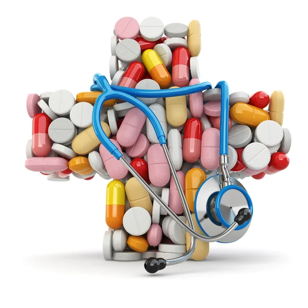 Concept of medicine. Cross from pills and stethoscope. — Stock Photo, Image