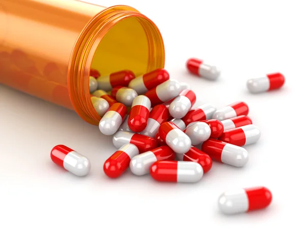 Medicine concept. Spilled pills from prescription bottle. — Stock Photo, Image