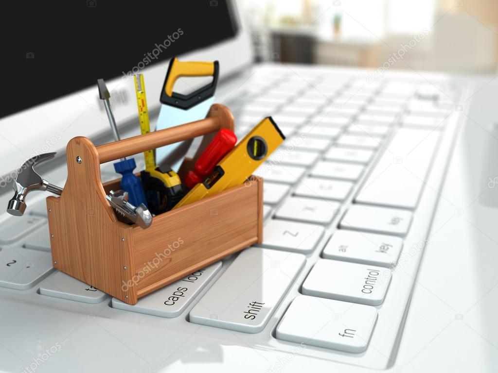 Online support. Toolbox with tools on laptop.