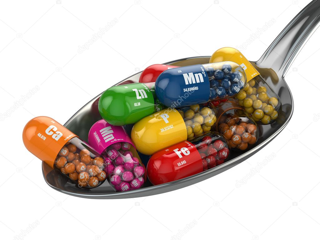Dietary supplements. Variety pills. Vitamin capsules on the spoo