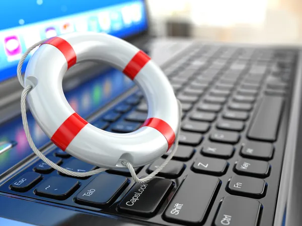 Stöd. laptop och livboj på laptop tangentbord. — Stockfoto