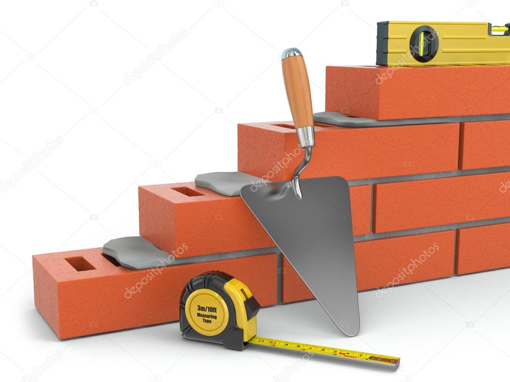 Construction concept. Brick wall trowel and level,