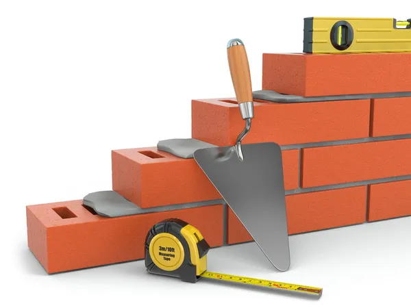 Construction concept. Brick wall trowel and level, — Stock Photo, Image