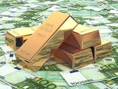 Gold ingots on background from euro banknotes.