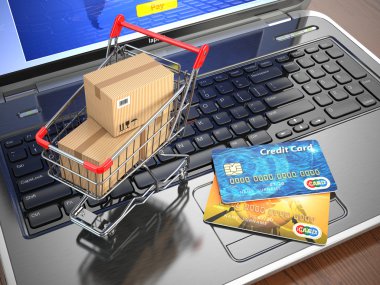 e-ticaret. alışveriş sepeti ve kredi kartı laptop.
