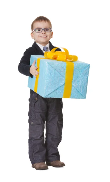 Small happy boy in spectecles with big present — Stock Photo, Image