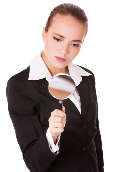 Attentive business woman with loupe — Stock Photo, Image