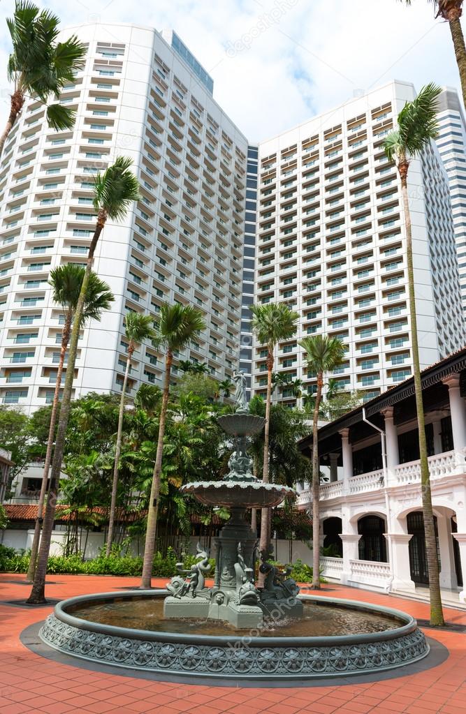 Fountain in classical colonial style and modern building , Singa