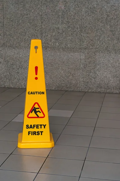 Caution wet floor sign on tiled floor — Stock Photo, Image