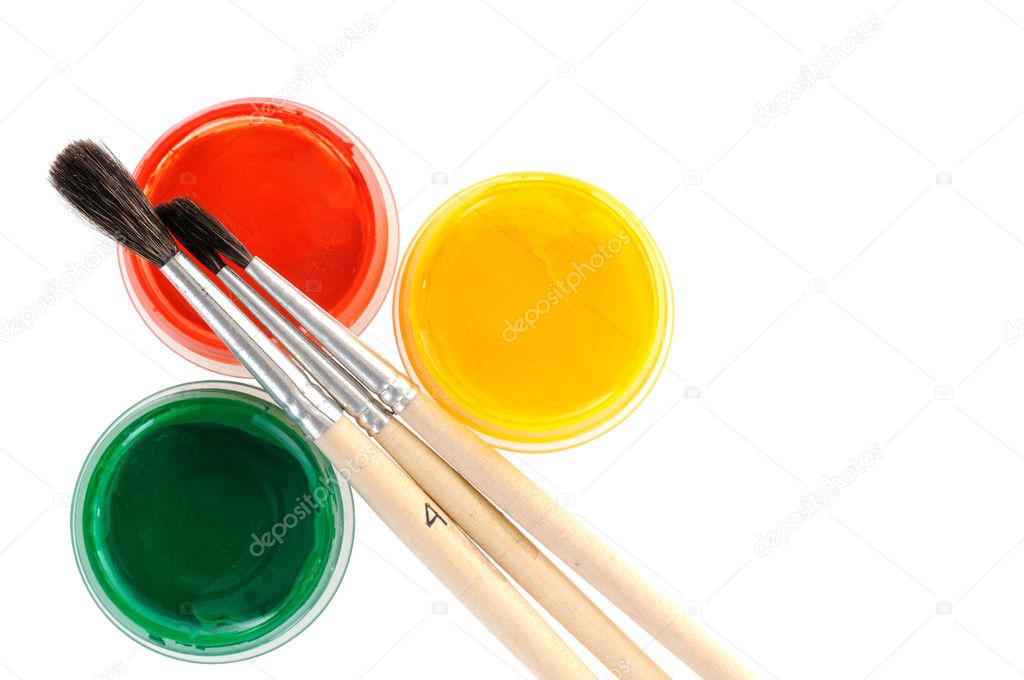 Paints with paint brushes over white background