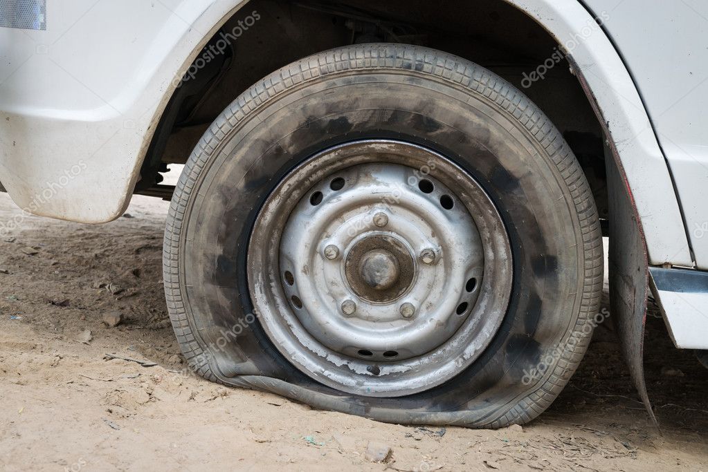 Deflated damaged tyre — Stock Photo © Iryna_Rasko 17817659