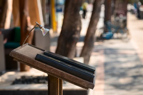 Menu book in outdoor vintage cafe — Stock Photo, Image