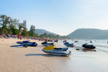 Patong beach with tourists and scooters, Phuket, Thailand clipart