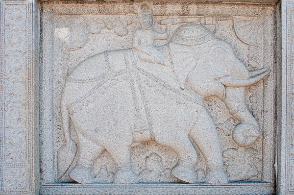 Carving with man riding elephant — Stock Photo, Image