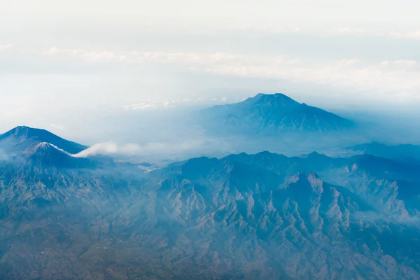 Volcano top under sky, bird 's eye view . — стоковое фото