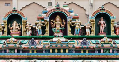 Hindu Gods on a temple facade clipart
