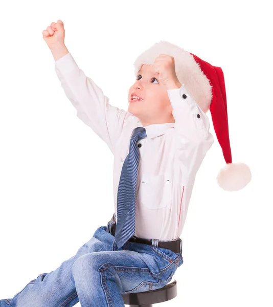 Little happy boy in red santa hat — Stock Photo, Image