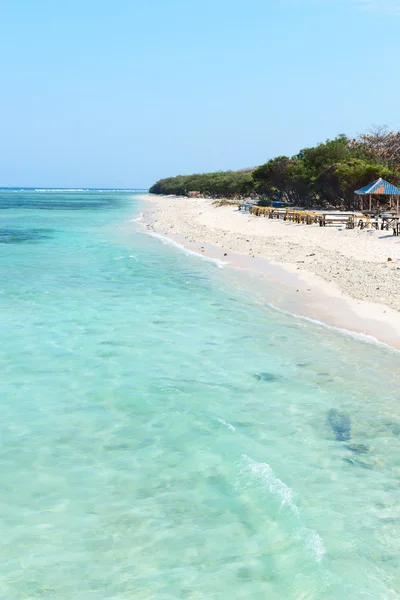 Beautiful beach with blue clean water and cafe — Stock Photo, Image