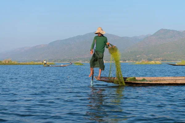 Unique leg rowing style and fishing in Burma — Stock Photo, Image