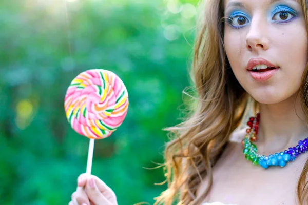 Pretty caucasian woman with bright funny lollipop — Stock Photo, Image