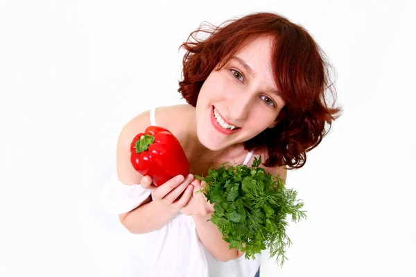 Jeune femme souriante aux légumes — Photo