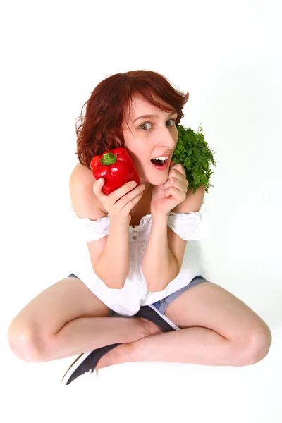 Amazed young woman with vegetables — Stock Photo, Image