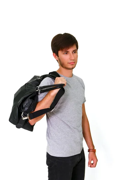 Caucasian young man with black bag — Stock Photo, Image