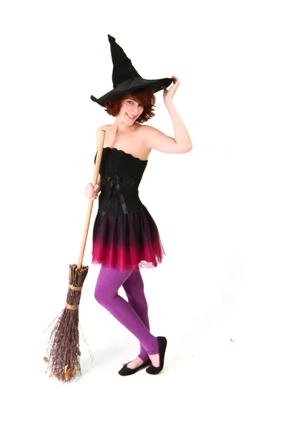 Halloween witch with a broom isolated over white background — Stock Photo, Image