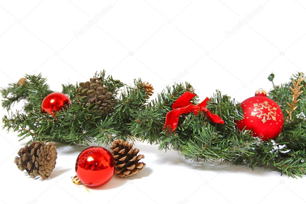 Christmas decorations and pine cones isolated on white backgroun