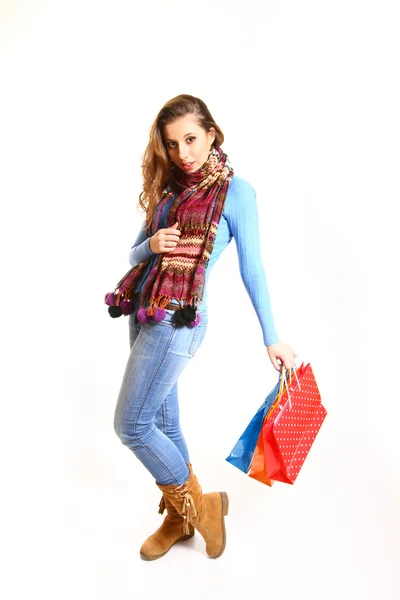 Chica con bolsas aisladas sobre fondo blanco — Foto de Stock