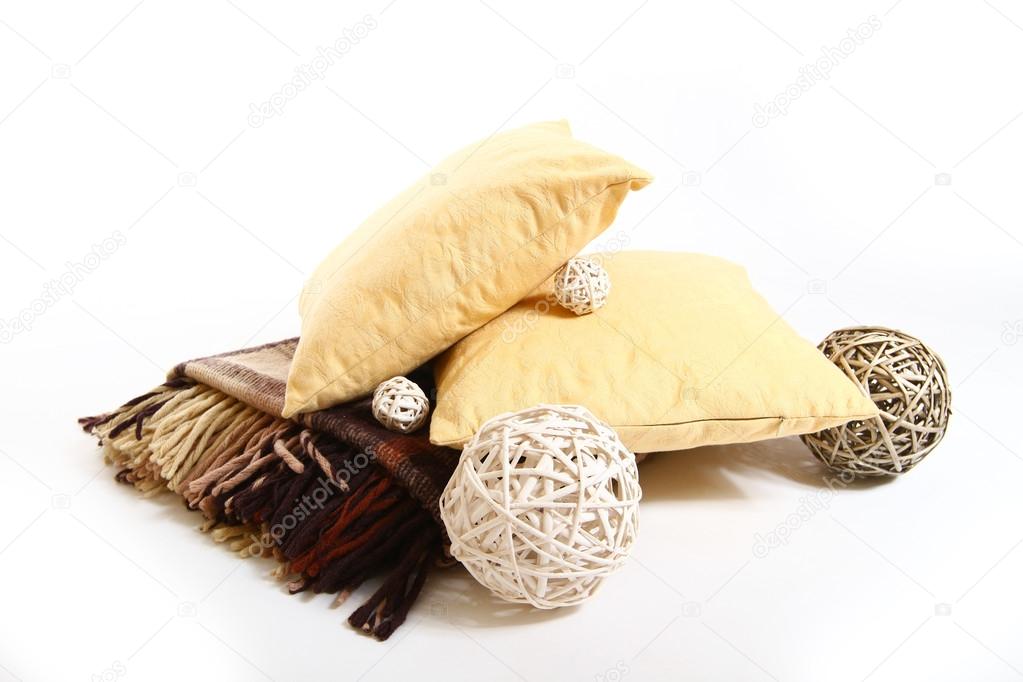 Pillow, plaid and wicker balls isolated on white background