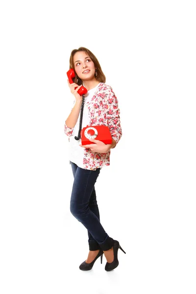 Lief meisje met een antieke telefoon geïsoleerd op een witte pagina — Stockfoto