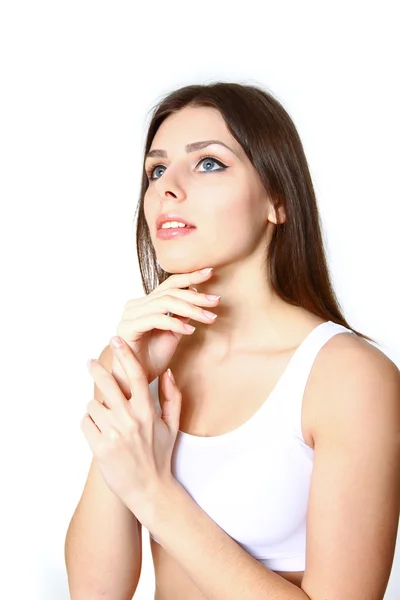 Young woman blowing on a dandelion in the summer park — Stock Photo, Image