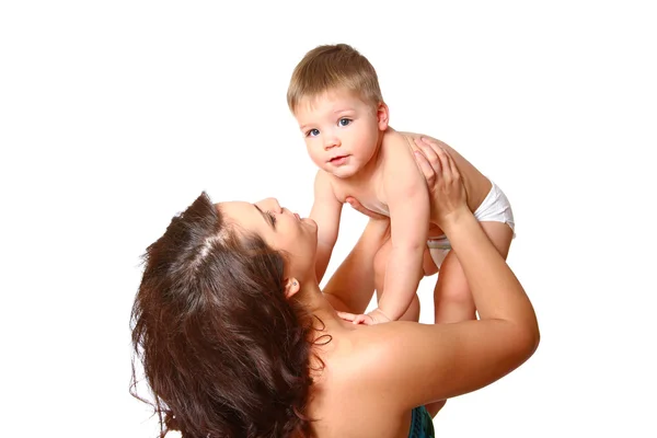 Молода мати тримає сина на руках на білому тлі Стокове Зображення
