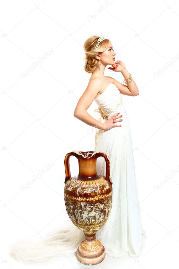 Beautiful young woman styled Greek with amphora on white backgr