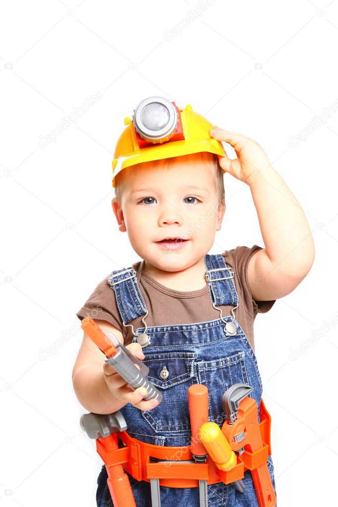 Boy in the orange helmet with tools on a white background