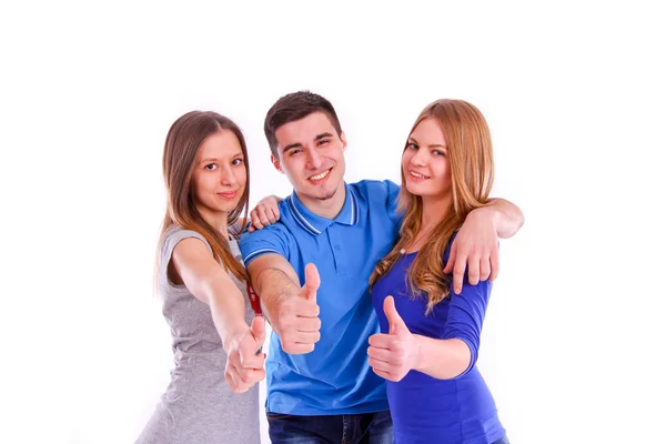Drie vrienden showins duimen omhoog ondertekenen op witte achtergrond — Stockfoto