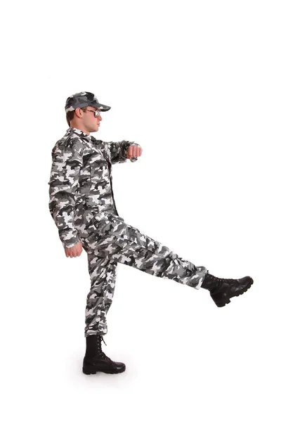 Soldier marching on a white background Stock Image