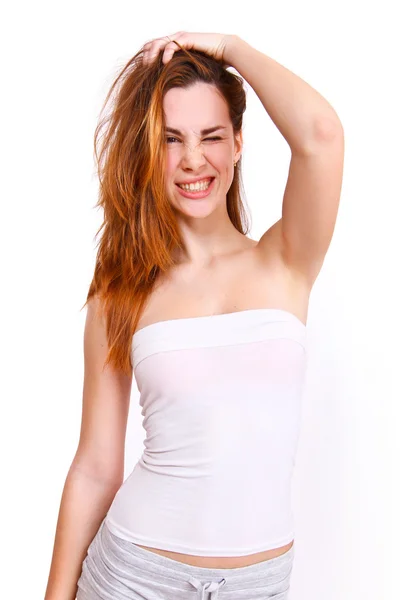 Young female  winking on white background — Stock Photo, Image