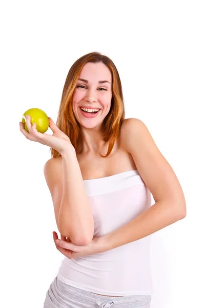 Attractive young woman with apple laughing — Stock Photo, Image