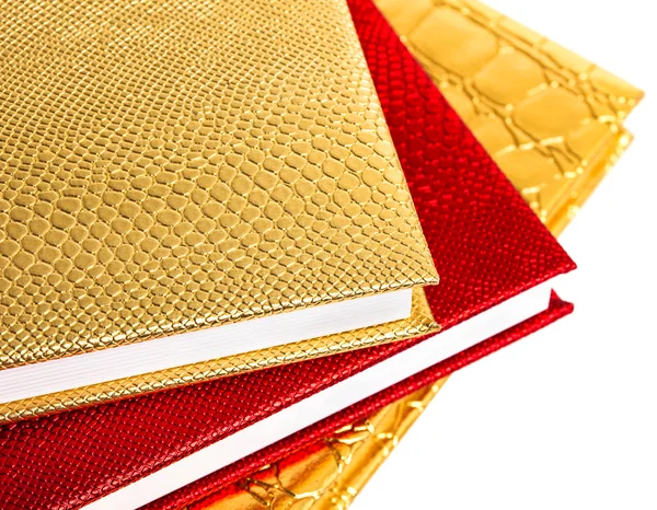 Cuadernos dorados y rojos aislados — Foto de Stock